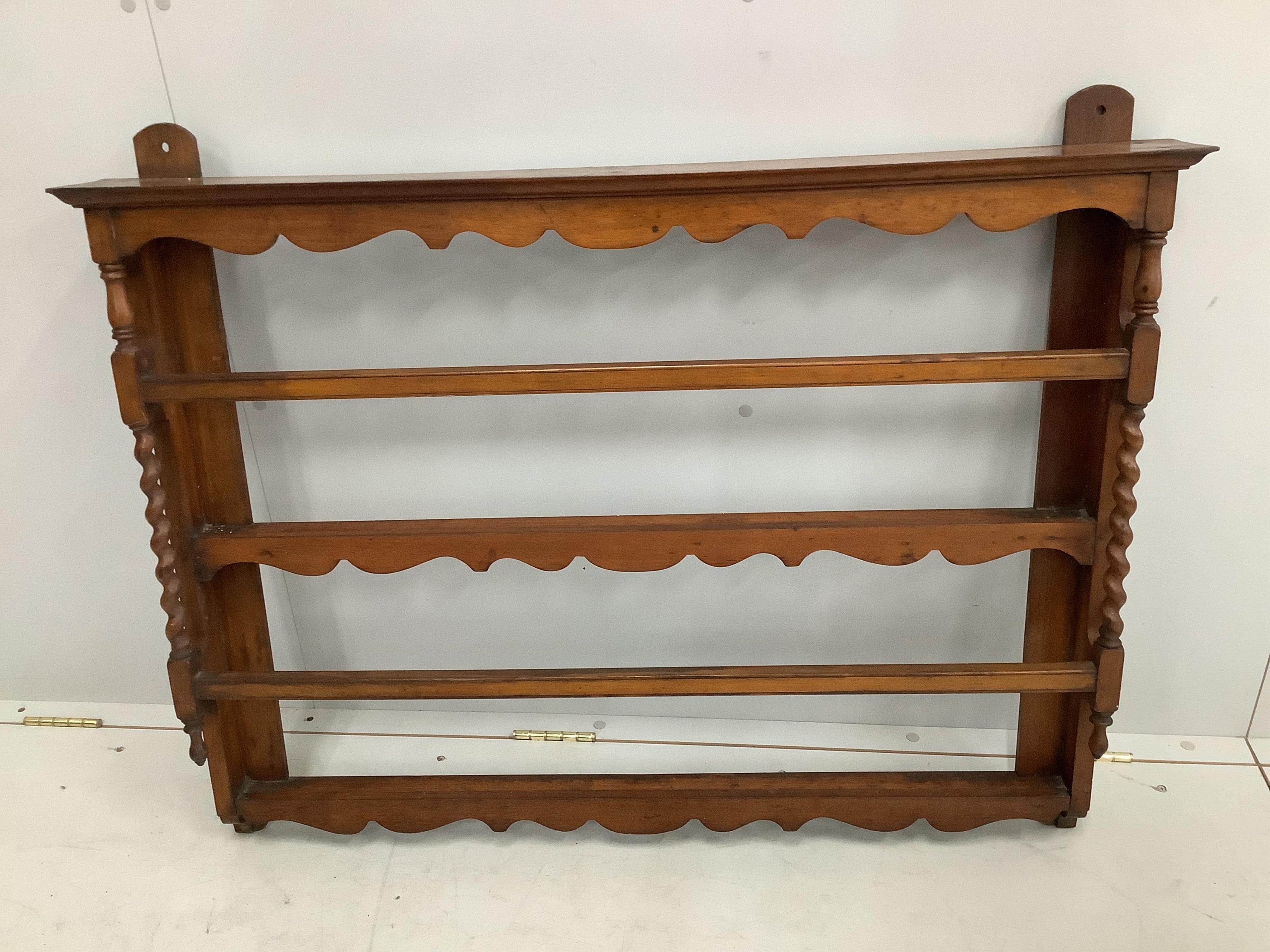 A small early 20th century mahogany plate rack, width 104cm, height 82cm. Condition - fair